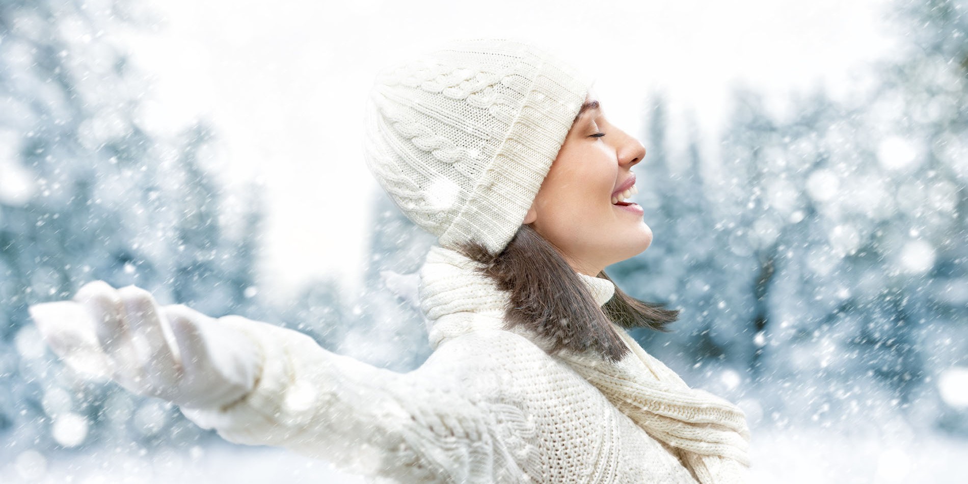 Happy young woman on a winter walk in nature.